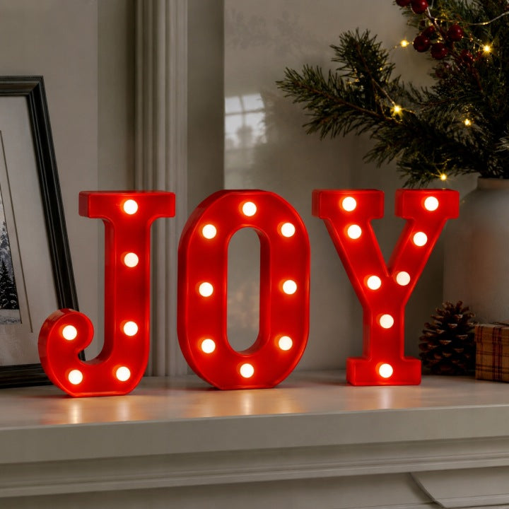 Świecący napis JOY LED z ciepłym białym światłem