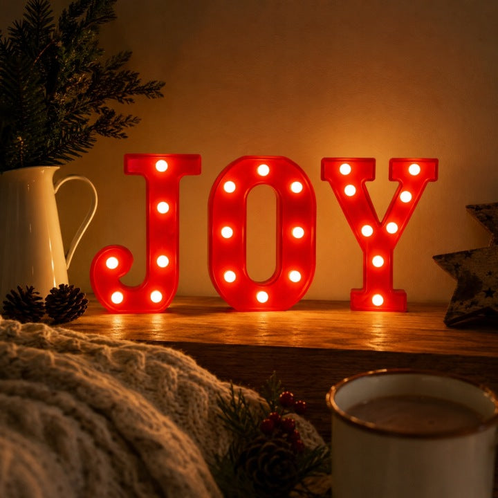 Świecący napis JOY LED z ciepłym białym światłem